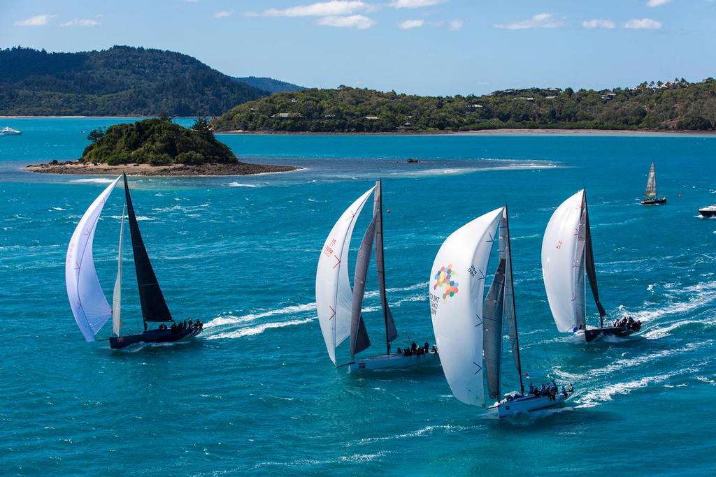 The fleet enjoying a fast spinnaker run out of Dent Passage past Plum Pudding Island. ©  Andrea Francolini Photography http://www.afrancolini.com/